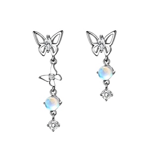 Asymmetric S925 silver butterfly earrings with moonstone and cubic zirconia tassels