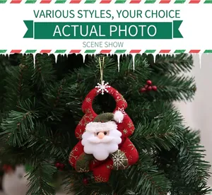 Detailed view of 3D Santa Claus ornament with red fabric and gold snowflakes on a green tree