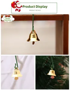 Detailed view of glossy gold Christmas bell with green hanging hook for holiday decor