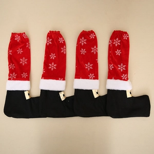 Set of 4 Christmas chair leg covers in Santa boot design with white snowflakes