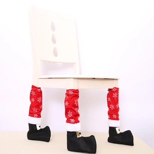 Christmas chair leg covers in red velvet with snowflake patterns and black boot design