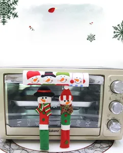 Detail view of festive snowman plush covers for microwave and oven handles