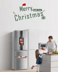 Close-up of snowman themed Christmas refrigerator handle covers in a modern kitchen scene