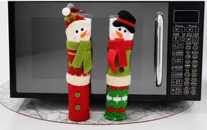 Detailed close-up of 3D snowman themed Christmas handle covers on a microwave