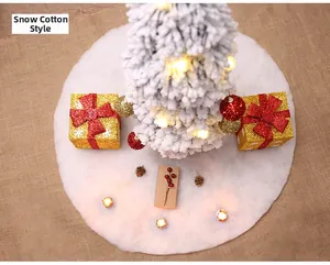 Close-up of white snow-cotton plush Christmas tree skirt with festive holiday decor