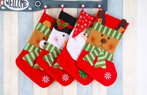 Detailed view of four festive Christmas stockings featuring 3D Santa, Snowman, and Reindeer dolls