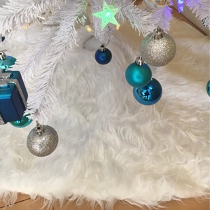 Plush pure white Christmas tree skirt with long faux fur for festive floor decoration