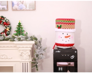 Detailed view of snowman Christmas water dispenser cover with red tassels and knit texture
