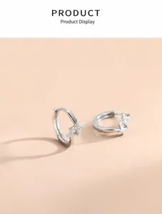 Macro view of silver star earrings featuring zircon inlay and s925 silver finish
