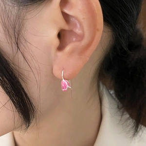 Pink tulip drop earrings with silver hooks worn by model for a sweet French vintage look
