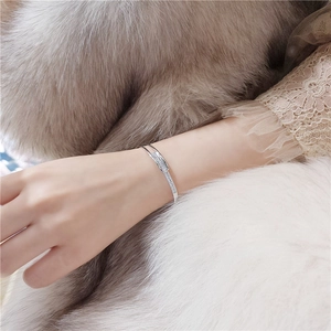 Elegant S925 sterling silver cuff bracelet with interlocking pave zircon circles on wrist