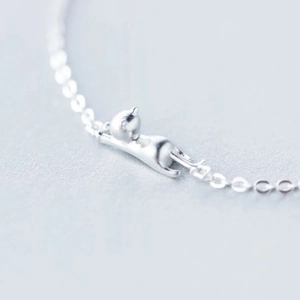 Elegant S925 silver bracelet featuring a cute climbing kitten pendant with minimalist chain