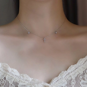 S925 silver heart cross and star necklace with zircon pavé worn on a female neck