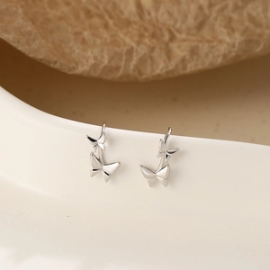 Elegant S925 sterling silver butterfly drop earrings on minimalist aesthetic background