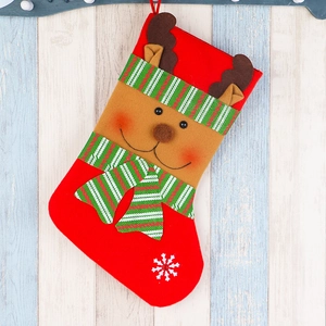 Red Christmas stocking featuring a 3D reindeer and white snowflake on wooden background