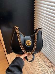 Chic black crescent moon handbag with chunky gold chain strap and metal lock detail