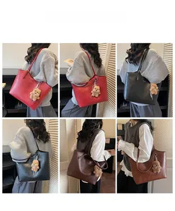 Three color options of large capacity tote bag with bear charm shown on model