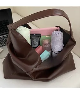 Interior view showing large capacity for laptop and umbrella in dark brown tote bag