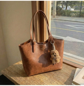 Retro tan tote bag with Fashion Lady text and cute plush bear charm detail