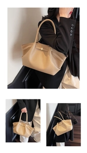 Detail of khaki tote bag with lychee texture and golden metal buckle for office daily wear