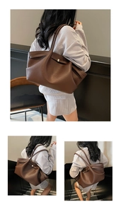 Macro detail of brown pebble grain leather tote bag with elegant accordion side fold design