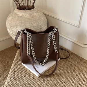 Deep coffee glossy leather tote bag with silver chain straps and long shoulder strap