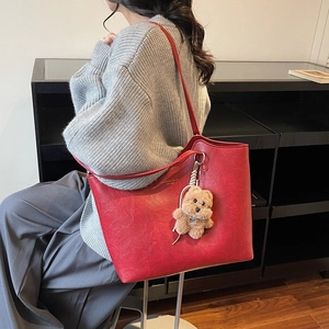 Retro red large capacity tote bag with bear charm and golden text for winter fashion