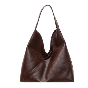 Large vintage dark brown faux leather tote bag with minimalist shoulder strap design