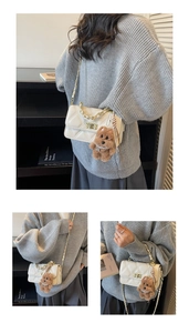 Detail view of cream quilted shoulder bag with gold chain strap and plush bear charm
