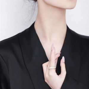 Close-up of luxury scale-design adjustable ring with shimmering crystal pavé setting