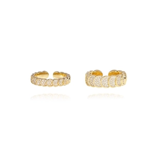 Luxurious gold open rings with scale pattern and sparkling zircon stones on white background