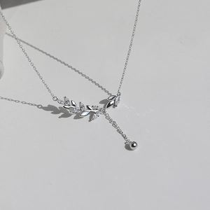 Elegant S925 silver necklace with sparkling marquise crystal wheat ear pendant on grey background