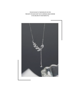 Detailed view of S925 silver wheat ear necklace with sparkling zirconia and bead drop