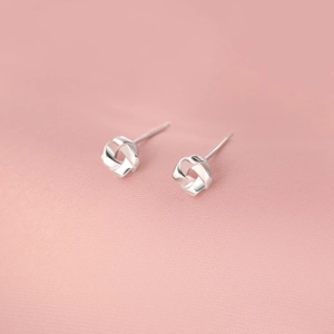 Minimalist S925 sterling silver knot stud earrings with polished intertwined design