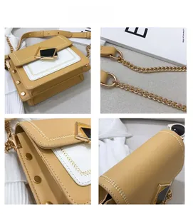 Détail du sac bandoulière en cuir jaune et blanc avec rivets dorés et bandoulière