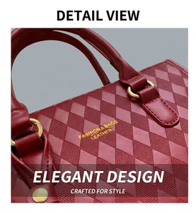 Close-up of dark red quilted leather handbag with gold ring hardware and logo detail