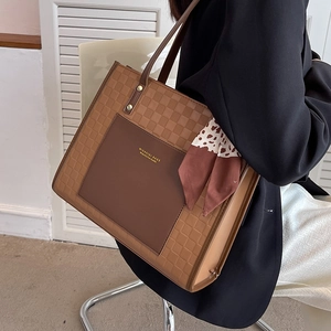 Vintage brown leather tote bag with checkerboard pattern and silk scarf handle decor