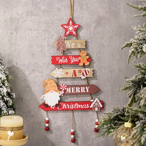 Rustic wood Christmas tree wall hanging with gingerbread man and gnome decorations