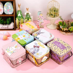 Detail of colorful Easter bunny tin baskets with handles and Happy Easter floral prints