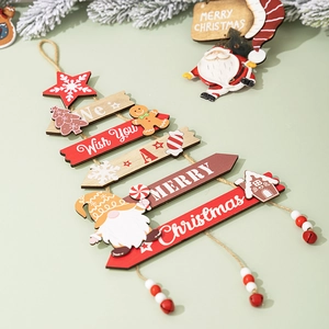 Detail of multi-layer wooden Christmas tree pendant with gingerbread man and red beads