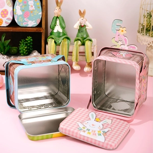 Detail of Easter tin baskets featuring pink plaid and blue weave patterns with bunny designs
