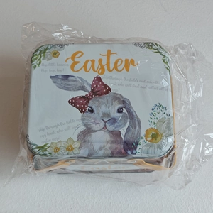 Easter tin storage box with rabbit illustration, yellow handle and festive lettering