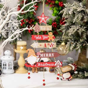 Christmas tree shaped wooden tiered sign with gingerbread man and gnome decorations