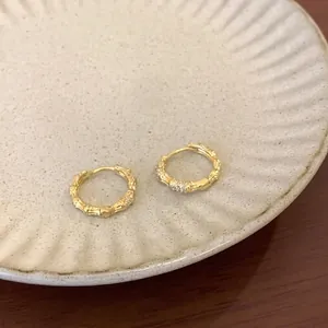 Elegant gold bamboo hoop earrings crafted in S925 silver with sparkling zircon stones