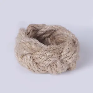 Detailed view of hand-woven hemp rope napkin ring with natural rustic braided texture