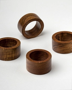 Set of four handmade walnut wood napkin rings with natural grain and smooth finish