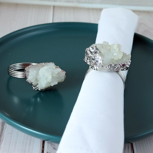 Silver metal napkin ring set featuring natural white crystal cluster for elegant table decor