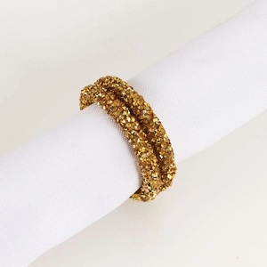 Elegant gold napkin ring with sparkling crystals for wedding and party table settings