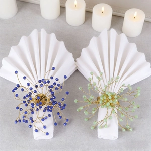 Detailed handmade crystal napkin ring with blue beads and gold wire for dining