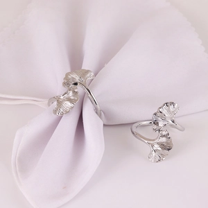 Elegant silver ginkgo leaf napkin rings set with polished finish for upscale dining